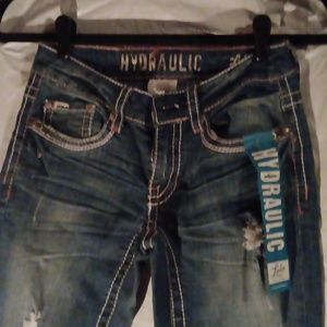 Nwt curvalicious boot cut Jean with rips and white stitching, button pockets